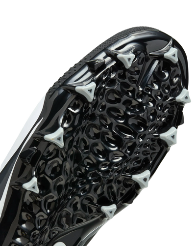 Close-up of Nike Alpha Menace Varsity 4 cleat black and white outsole with triangular cleats for traction